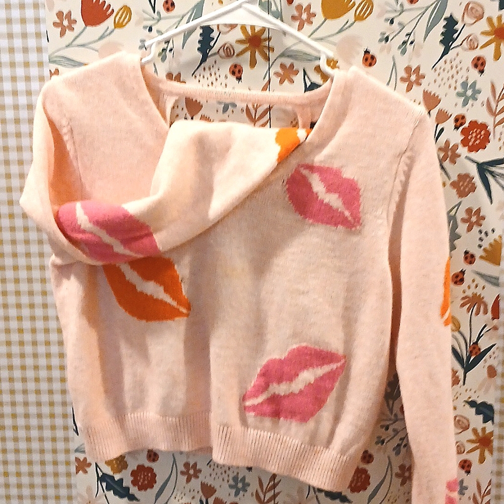 Light pink Kiss sweater perfect for Valentines day